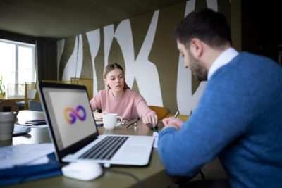 medium-shot-people-talking-office_23-2149345220