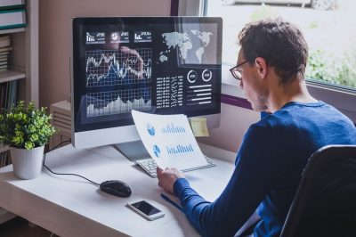 Entrepreneur,Reading,Financial,Report,On,Dashboard,,Fintech,And,Audit,Concept,